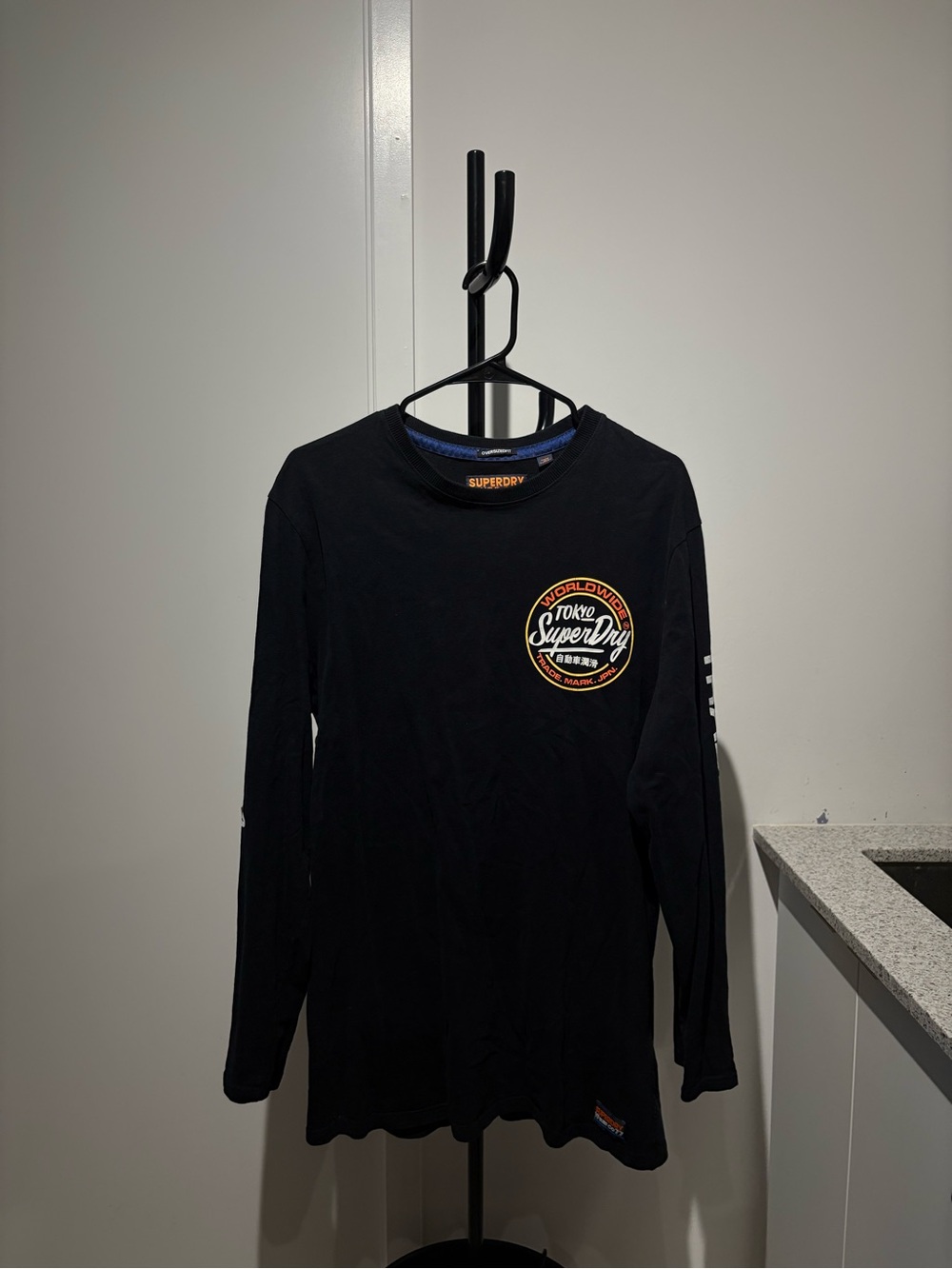 Superdry Black Long Sleeve Tee with Orange and White Logo Patch